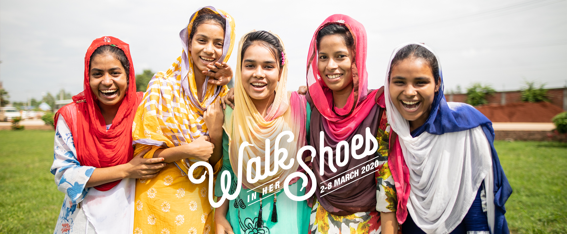 Walk in her Shoes logo over image of five girls smiling.