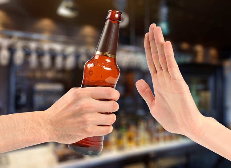 someone holding a beer bottle another hand saying no